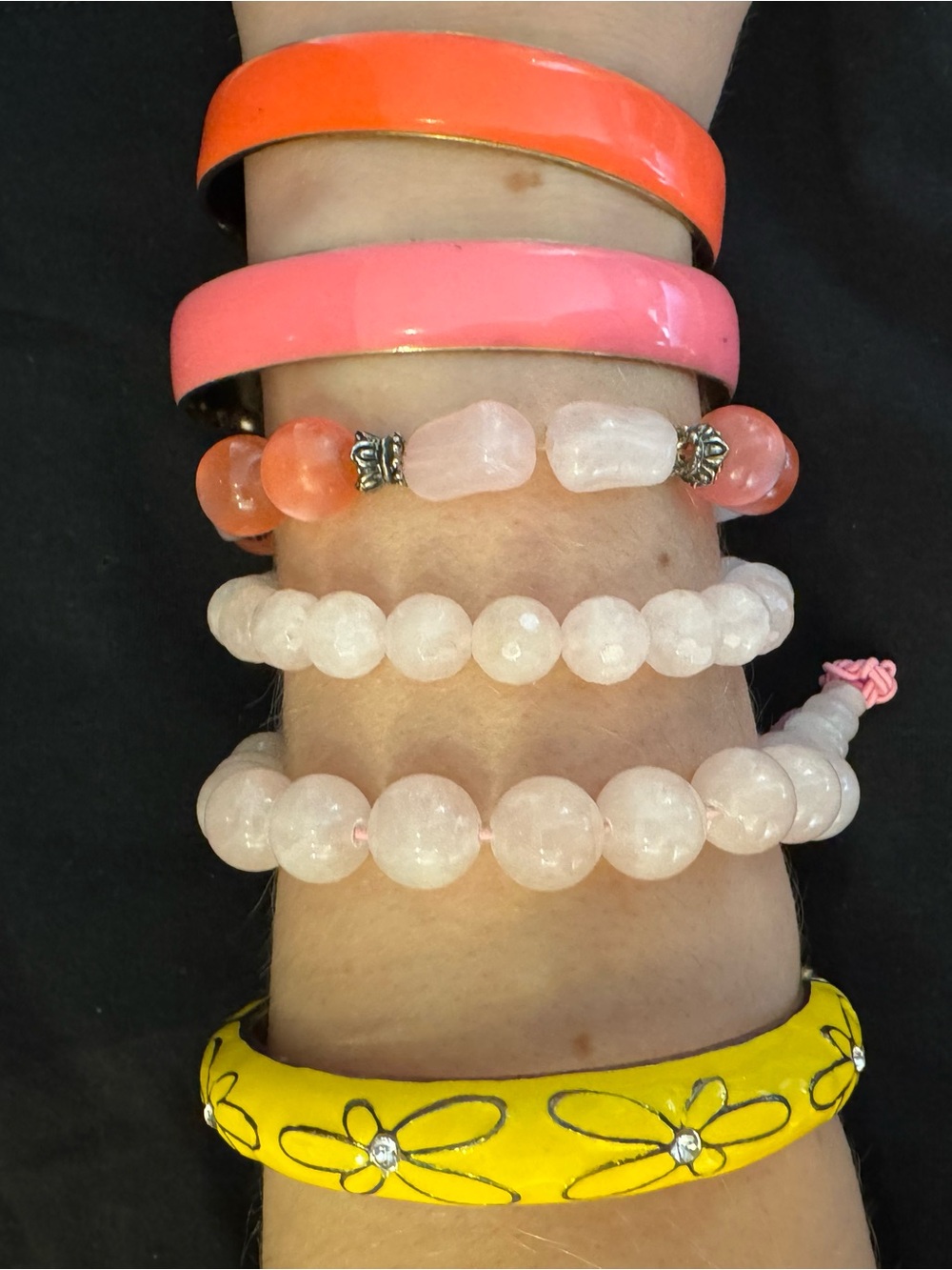 Multiple bracelets - pink, orange, yellow